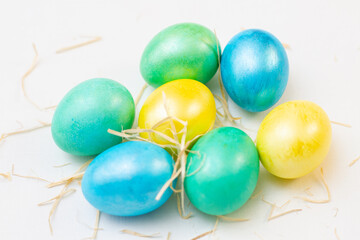 Fototapeta na wymiar Bright easter eggs with fluffy on white background