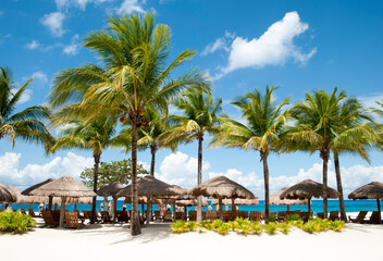 Fototapeta na wymiar Cozumel Island Beach With Straw Umbrellas