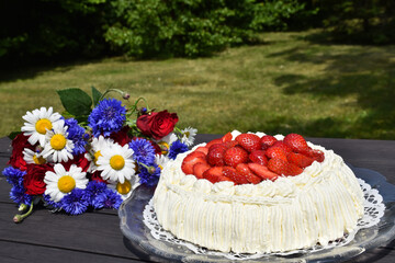 Summer flowers and yummy cream cake