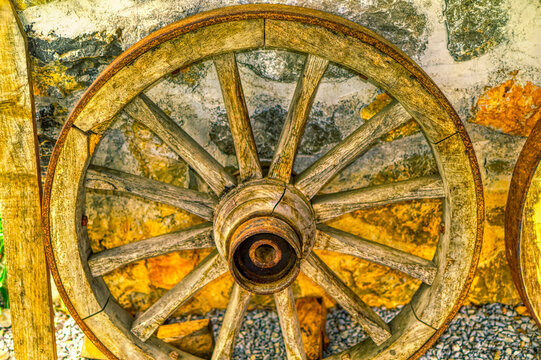 Old wooden wheel used at horse carriage.
