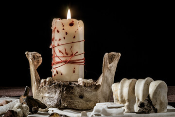 Witchcraft attributes: burning bloody candle and bones - 404104731