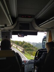 dangerous bus ride on a curvy road next to the cliff