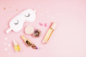 Classic alarm clock, sleeping mask and herbal tea.  Minimal concept of rest, quality of sleep, good night, insomnia, relaxation