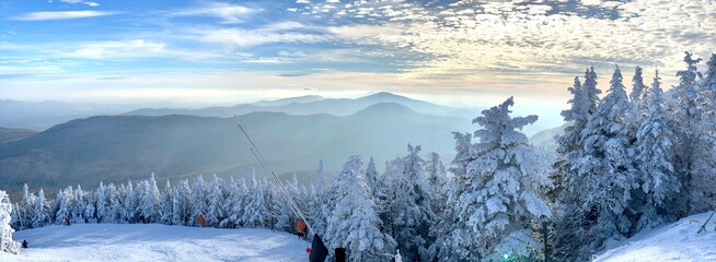 Panoramic mountain view of beautiful mountain peaks at snow day on the top of Stowe Mountain Ski...