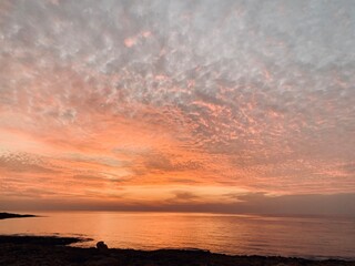 Pink orange Sunset over the sea Burning Down