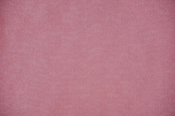 Silk fabric, shiny organza is light peach color as background.