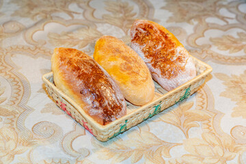 Delicious baked homemade dough pie in a wicker wooden dish