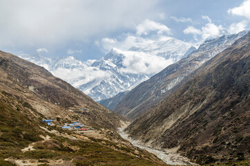 Annapurna III behind clouds seen from Yak Kharka, Annapurna Circuit, Nepal