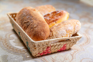 Delicious baked homemade dough pie in a wicker wooden dish