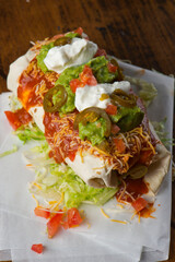 Burritos or tacos. Mexican or Tex-Mex food favorite. Seasoned meat, refried or black beans, Mexican rice, cheese, fried vegetables wrapped in homemade tortillas and served with salsa. Takeout favorite