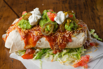 Burritos or tacos. Mexican or Tex-Mex food favorite. Seasoned meat, refried or black beans, Mexican rice, cheese, fried vegetables wrapped in homemade tortillas and served with salsa. Takeout favorite