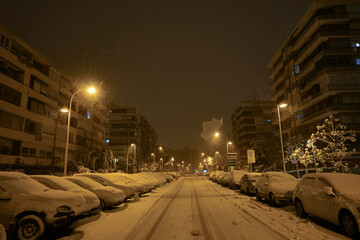 Fototapeta premium The storm Filomena leaves a historical snowfall in the streets of the Las Águilas neighborhood in Madrid. Spain