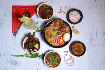 Indian chicken Biriyani with variety dishes on white background