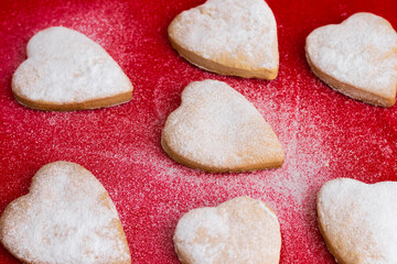 Fototapeta na wymiar cookies for the Valentine's Day holiday, heart shape on a red background.