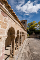 Fototapeta premium arcaded gallery of semicircular arches on paired columns, Church of the Savior, 13th century rural Romanesque, Carabias, Guadalajara, Spain