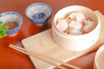 Ravioli typical of Japanese cuisine on wooden ravioli cooker, natural light inside restaurant
