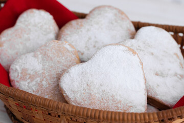 Heart-shaped cookies decorated for Valentine's Day.Cookies on a red background.The concept of the Valentine's Day holiday.