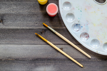 Acrylic paints on the table. Photo of art materials