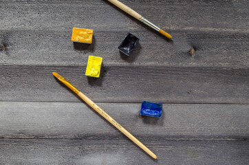 Acrylic paints on the table. Photo of art materials