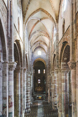 Fototapeta na wymiar the nave, columns and vault of the romanesque St Julien basilica in Brioude, Auvergne (France)