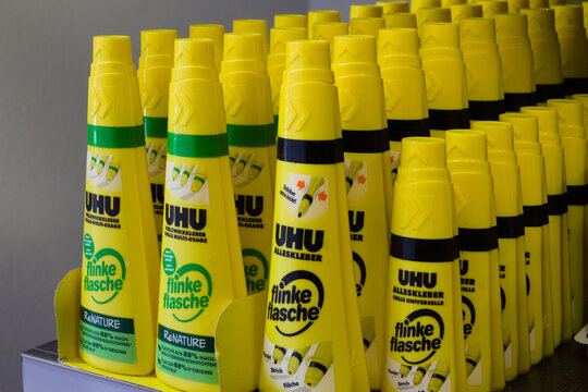 Schwaebisch Hall, Germany - January 9. 2021: Bottles of UHU glue in a shelf