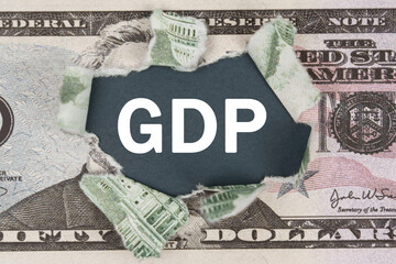 The dollar is torn in the center. In the center it is written - GDP