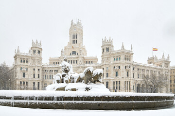 Madrid city council and cibeles fountain snow-covered in winter