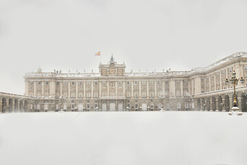 Fototapeta na wymiar Madrid royal palace snow-covered in snow storm