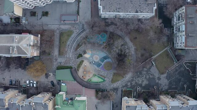 Aerial view on Colorful children's emty playground in a yard. Aerial footage empty childrens playgrounds