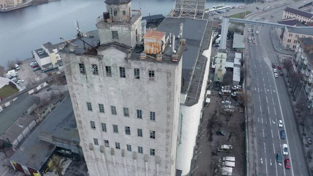Abandoned Concrete Grain Elevator building. Aerial view rows of tall concrete grain storage. Aerial view large waterfront grain storage facility. 