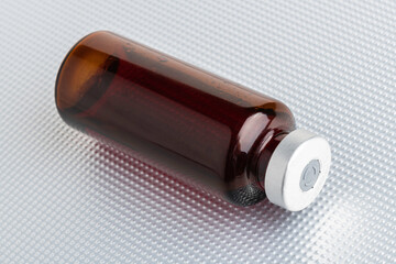 Macro Image Of Amber Vaccine Vial Set On Metal Background