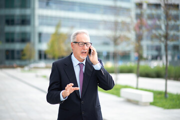 Senior businessman talking on the phone