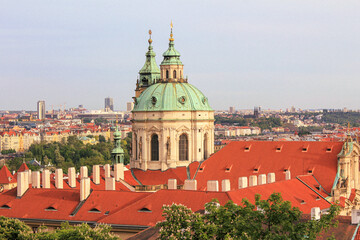 Obraz premium Towers of the Church of Saint Nicholas in Malá Strana at Prague.