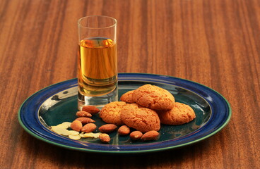 Amaretti biscuits, and a glass of Amaretto liqueur.