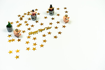 New year composition. Pigs, bottle and chimney sweeper on white background. Perspective view.