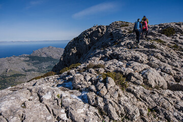 trekkers on the crest of Puig Tomir, 1103 meters, Escorca, Mallorca, Balearic Islands, Spain
