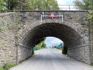 Fototapeta na wymiar Victorian stone railway bridge on, Barnard Road in, Bradford, Yorkshire, UK