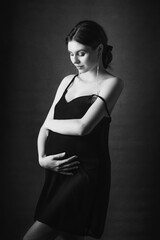 a young pregnant girl in a dress