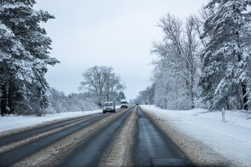 Fototapeta premium Country road after snowfall in Lithuania