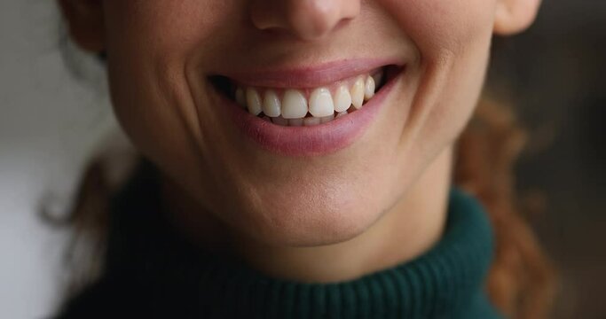 Wide white smile, healthy straight clean teeth of woman, close up female face part view. Satisfied client of bleaching whitening dental treatment procedure, dentistry and orthodontics services concept
