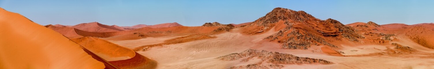 pano view from top of a dune with scenic rock formations in Namib Naukluft Park - Sesriem - Sossusvlei