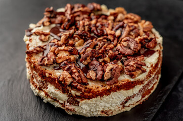 birthday cake with nuts on a stone background