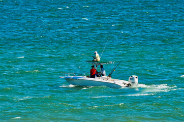 Boaters in Ocean Fishing with Negative Space