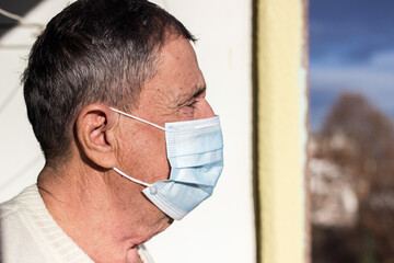 Senior man wearing medical facemask 