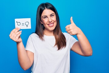 Beautiful woman asking for sex discrimination holding paper with gender equality concept smiling...
