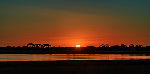 Fototapeta premium sunset over the river