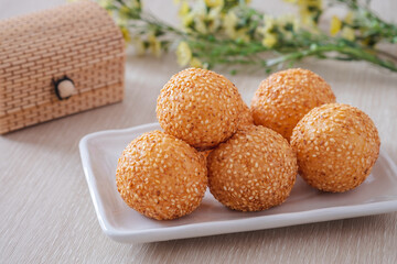 Sesame seed balls on white plate
