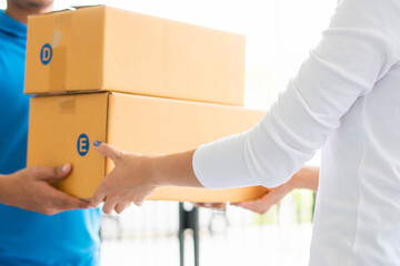 Asian deliveryman already delivers parcels to young female customers at her home.