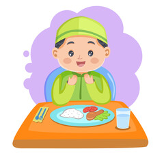 Moslem boy praying before eat