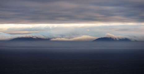 Fototapeta na wymiar Sunset, cloudy sky, mountains and Atlantic ocean in Co. Donegal, Ireland